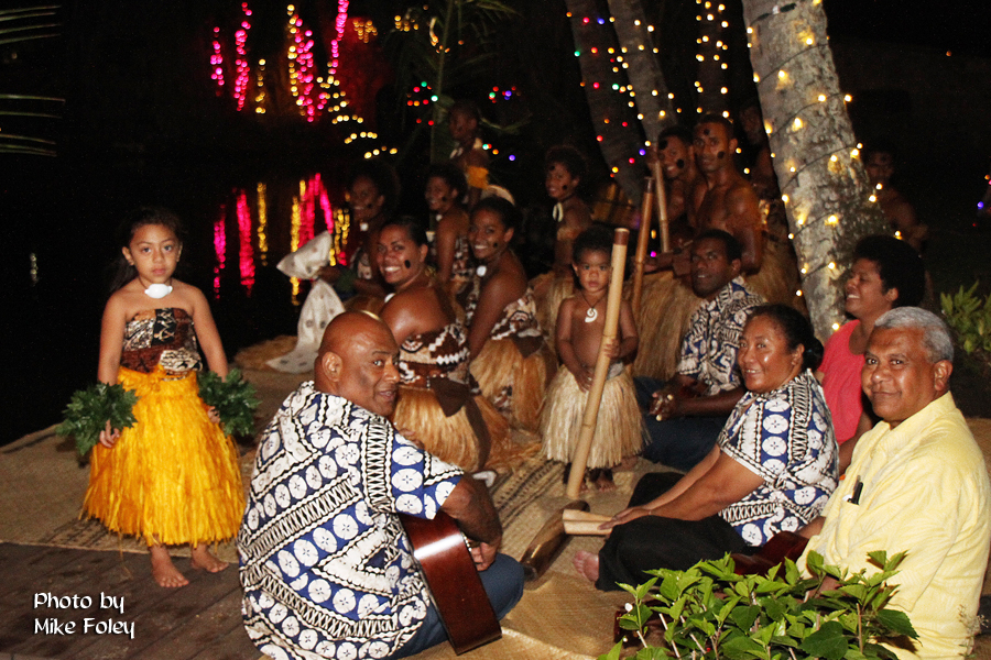 Fijian Villagers (Inoke Suguturaga, right) get ready to receive President Orgill and family during his "graduation" party special canoe ride