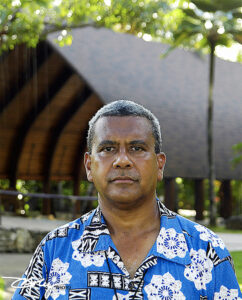 Ratu Seru Inoke Suguturaga, "chief" of the Fijian Village in 2004, stands in front of the camakau canoe's new "home."